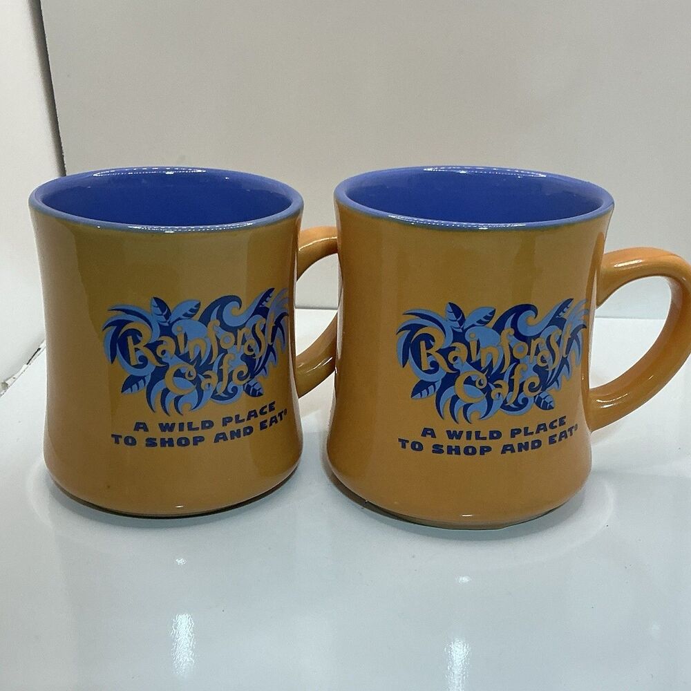 Rainforest Cafe 1999 Orange Blue Ceramic Coffee Mugs Set of 2 A Wild Place 12 oz